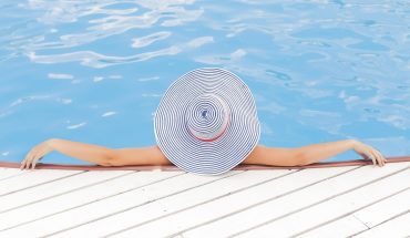 Woman relaxing by the pool